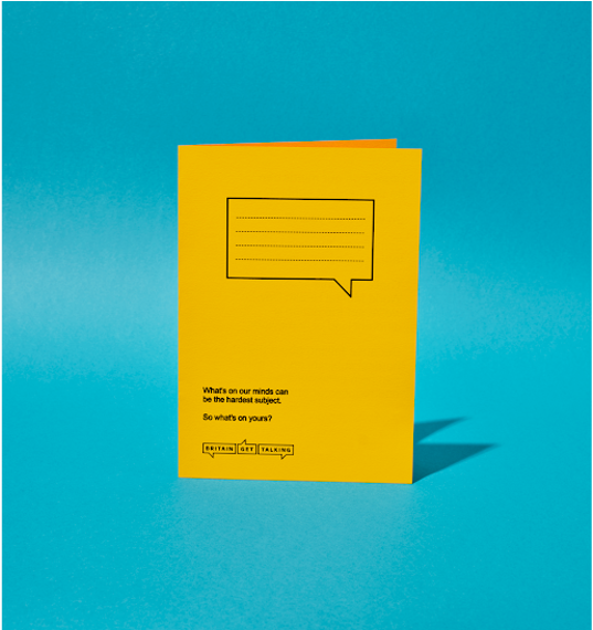A yellow coloured school jotter.  On the front page, there is an image of a speech bubble with lines